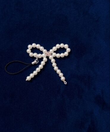 Bow shaped charm